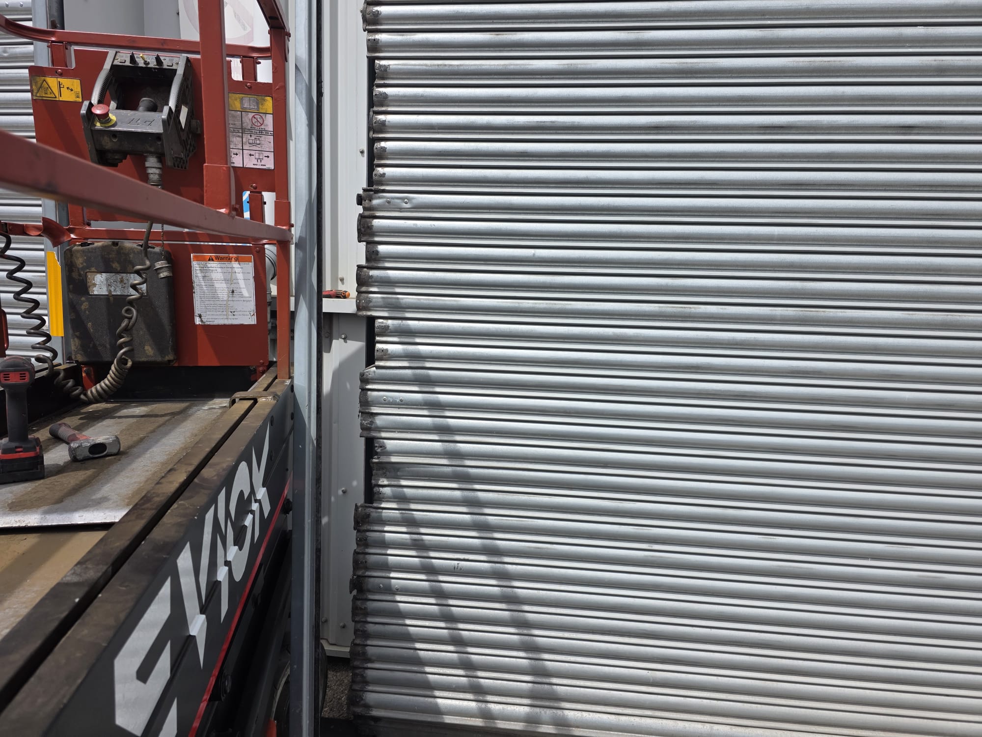 EVICK vehicle attending a roller shutter repair