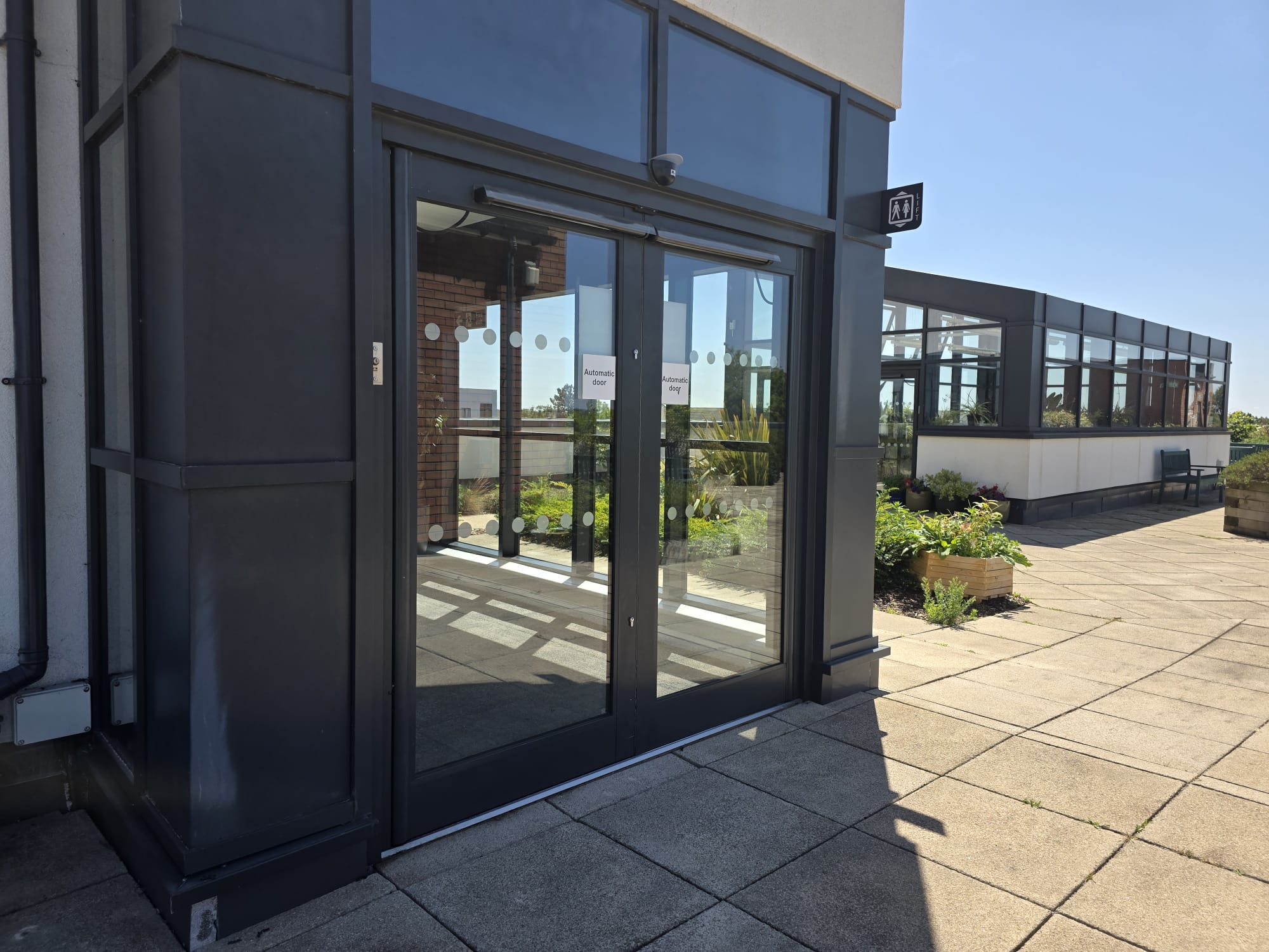 Exterior automatic swing entrance